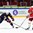 HELSINKI, FINLAND - DECEMBER 31: Denmark's Kristian Jensen #11 battles for the puck with USA's Scott Eansor #14 and Ryan Donato #19 during preliminary round action at the 2016 IIHF World Junior Championship. (Photo by Matt Zambonin/HHOF-IIHF Images)

